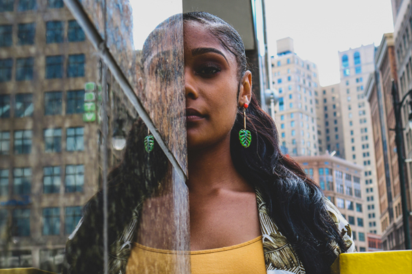 Create space for a heart-centered way of being to unfold with Tanya Morgan, Soul Coach and Shamanic Healing Medium. The Healing Mother Earth offerings include Soul Coaching, Soul Awakening, heartSPACE, Soul Space Mentoring, Journey with the Five Elements, Discover your Power Animal, Guided Meditation and Visualization Journeys, Mindfulness Meditation Group Practise and Co-creating with the Divine Sacred Feminine. This photo of a woman's reflection in a mirrored building is by Rio Watkins on Unsplash.